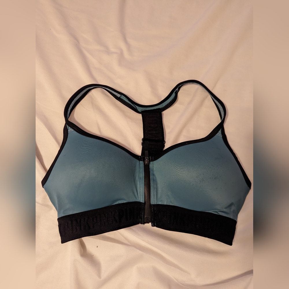 Pink front zipper sports bra